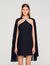 Vestido corto con capa adornada