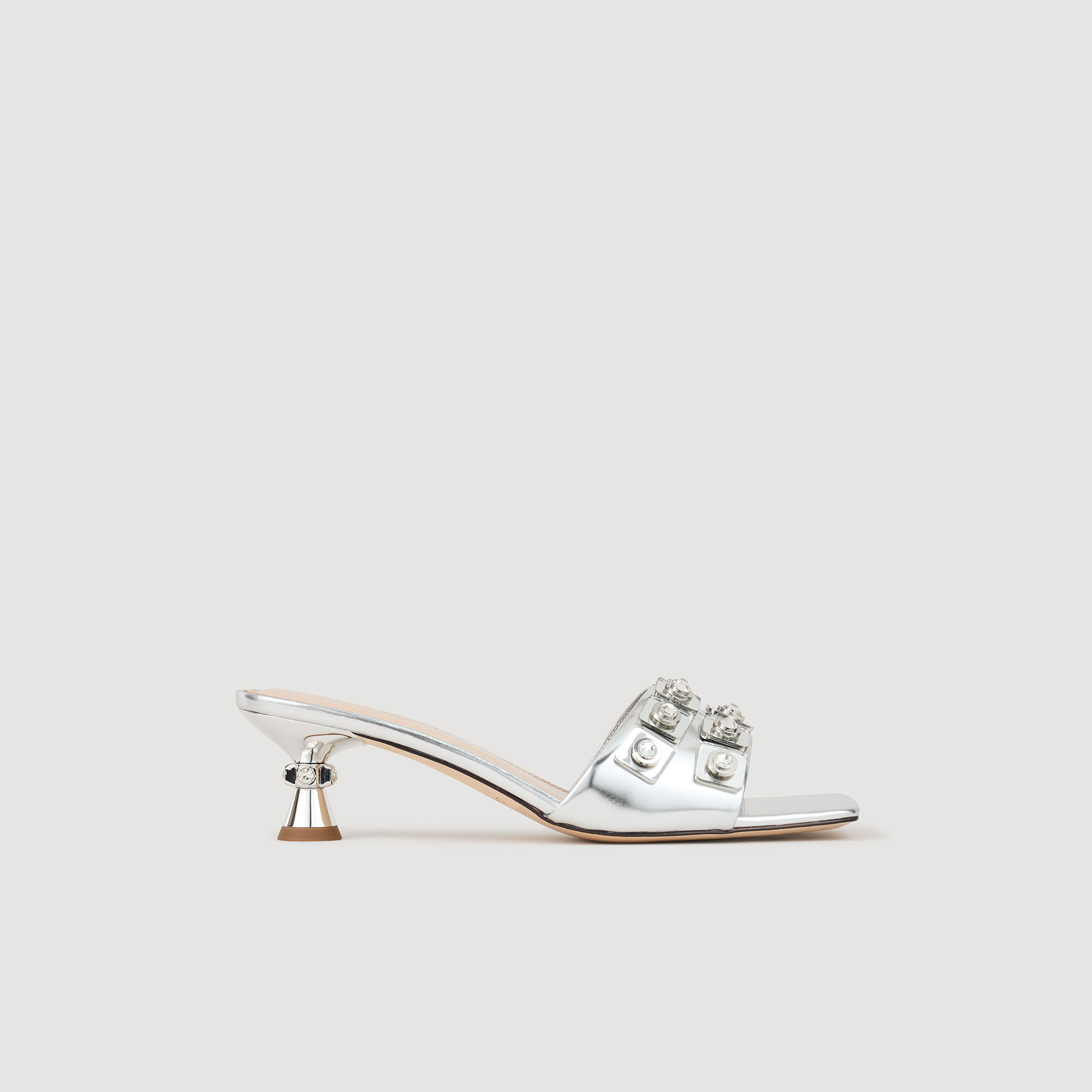 Zapatos destalonados de cuero metalizado