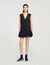 Vestido corto de sastre con volante