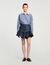 Falda corta de denim con volantes