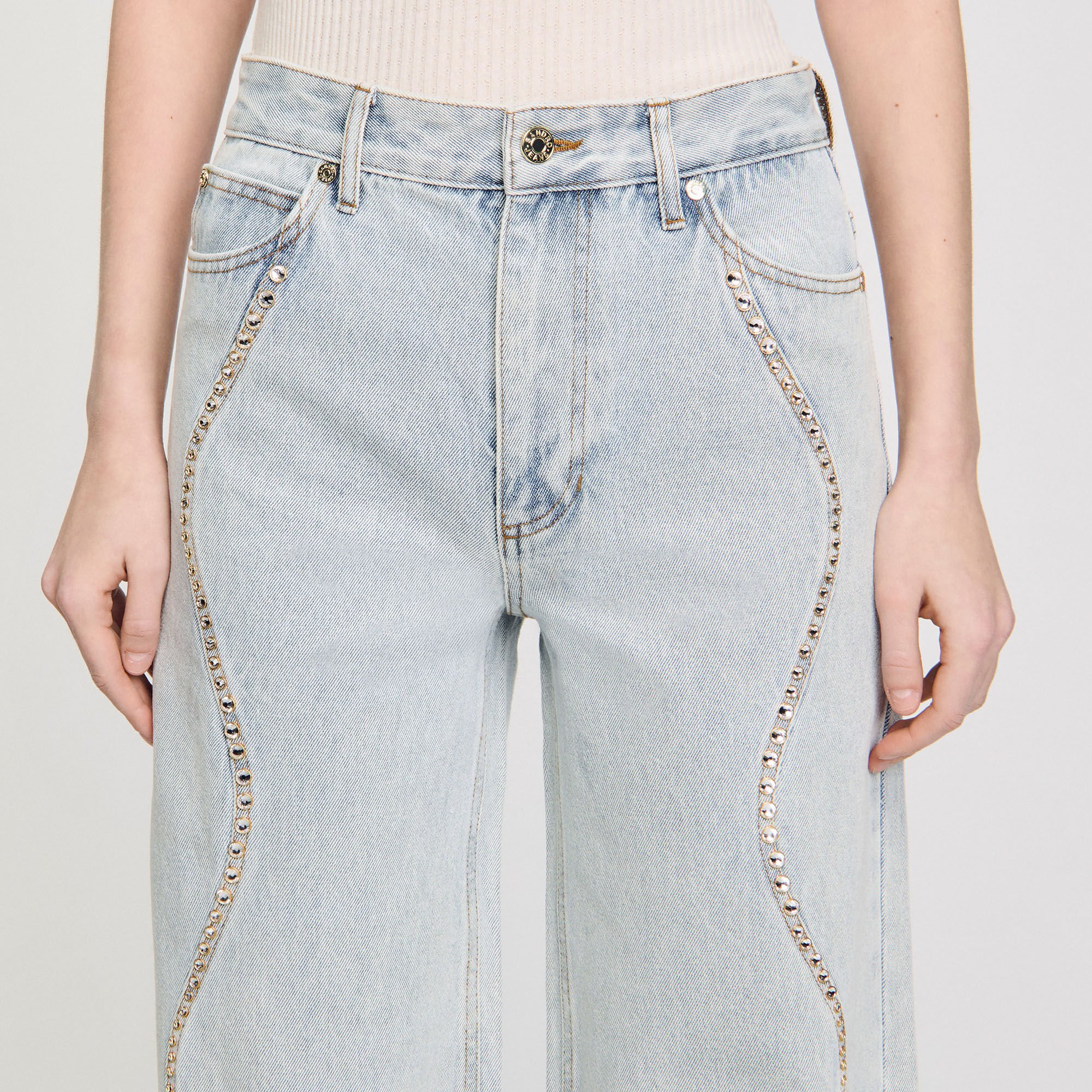 Vaqueros con tiras de strass