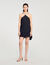 Vestido corto con capa adornada