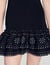 Vestido corto de punto con tachas