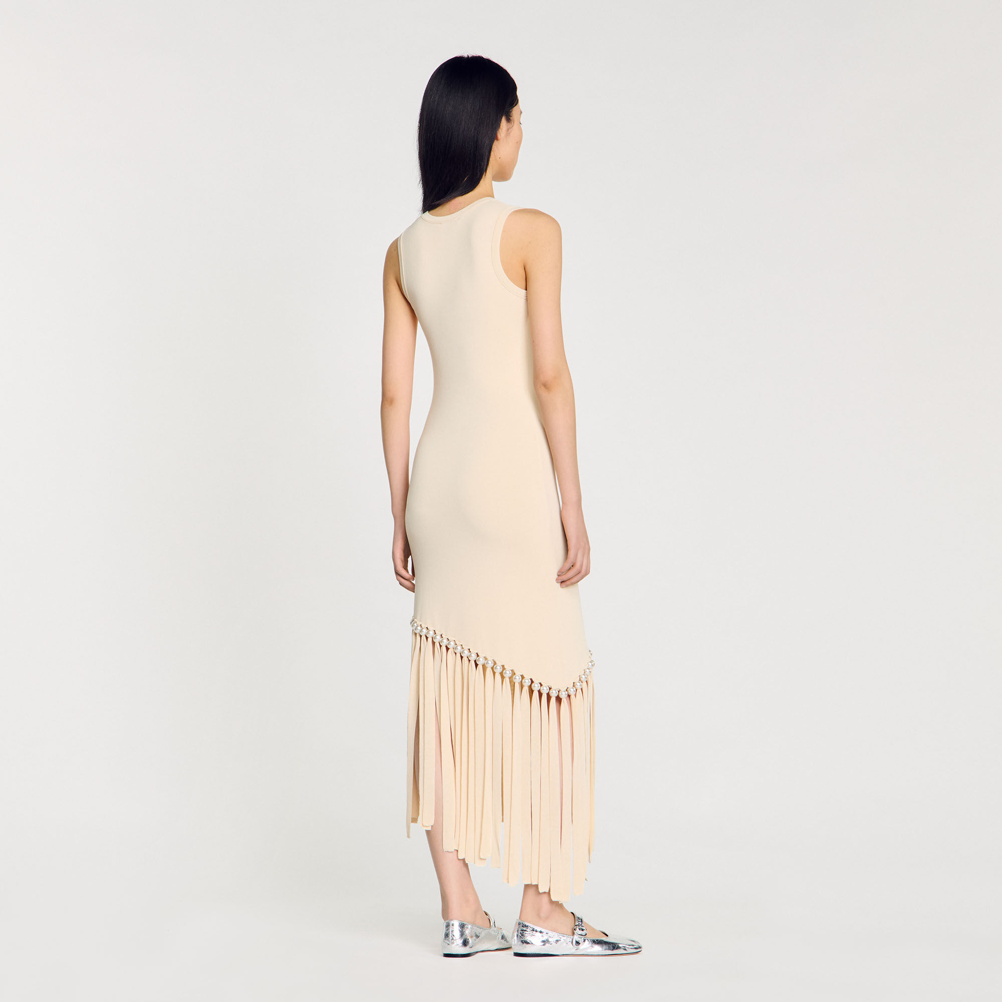 Vestido de punto con flecos y perla