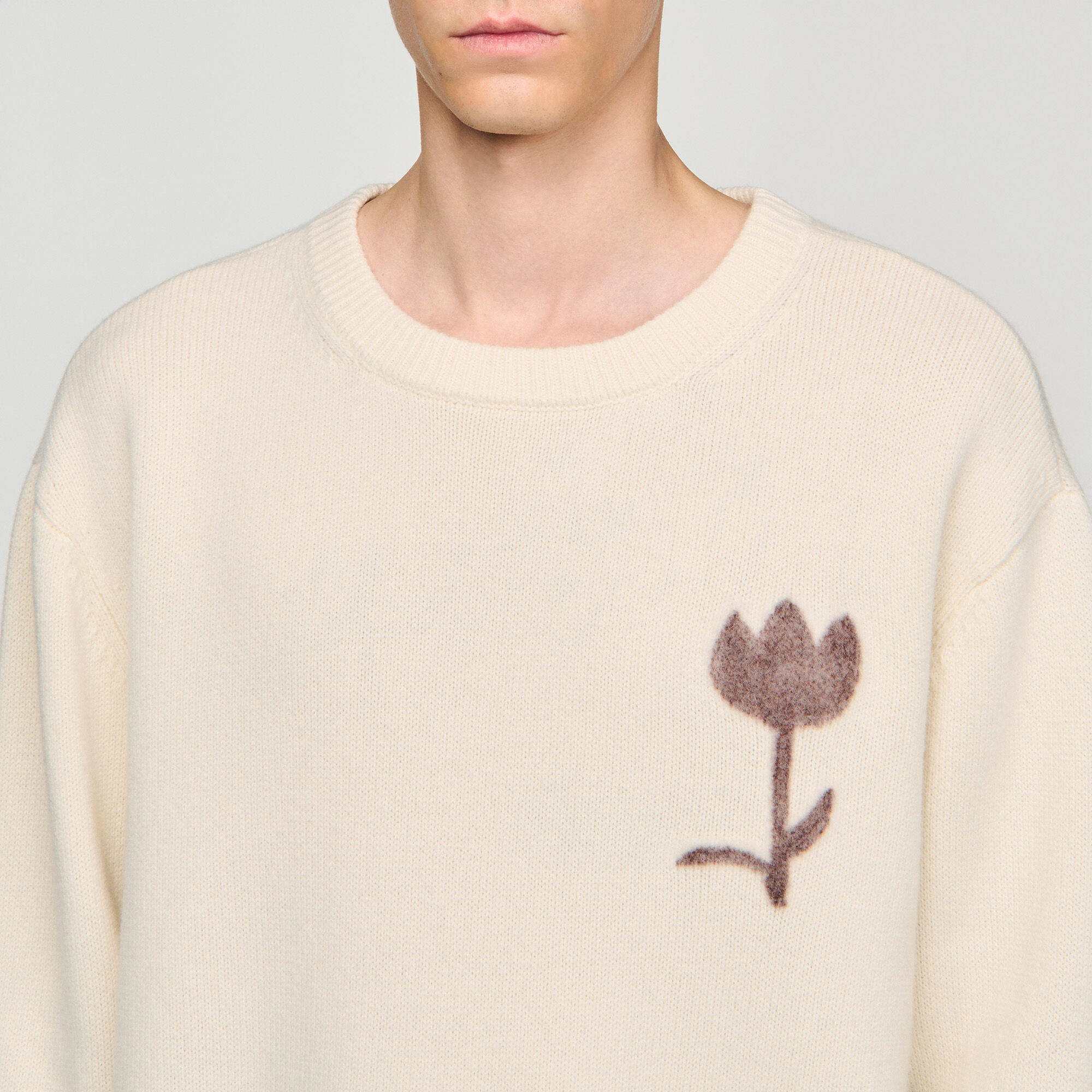 Jersey de lana con detalle de flor