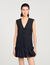 Vestido corto de sastre con volante