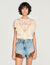 Top corto de guipur floral