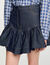 Falda corta de denim con volantes