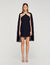 Vestido corto con capa adornada